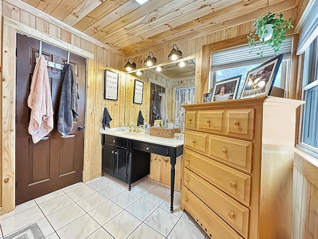 bathroom featuring wooden ceiling, tile patterned flooring, wood walls, and vanity