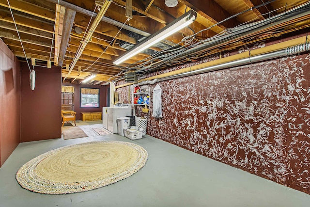 basement with washing machine and clothes dryer