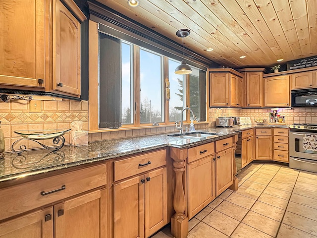 kitchen with black appliances, dark stone countertops, brown cabinetry, and a sink