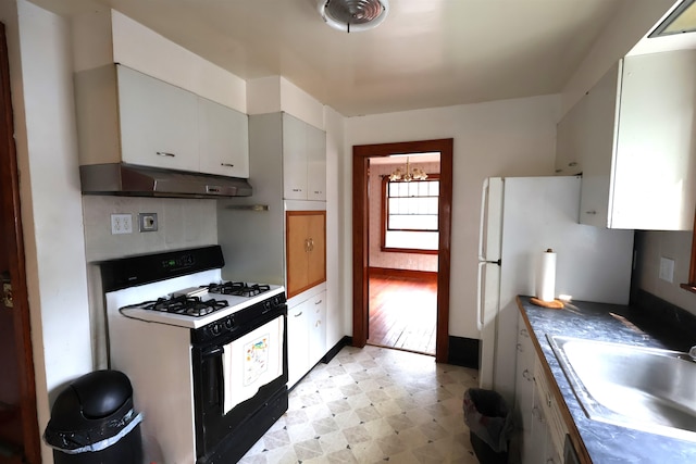 kitchen featuring sink, white cabinetry, gas range gas stove, and light hardwood / wood-style floors