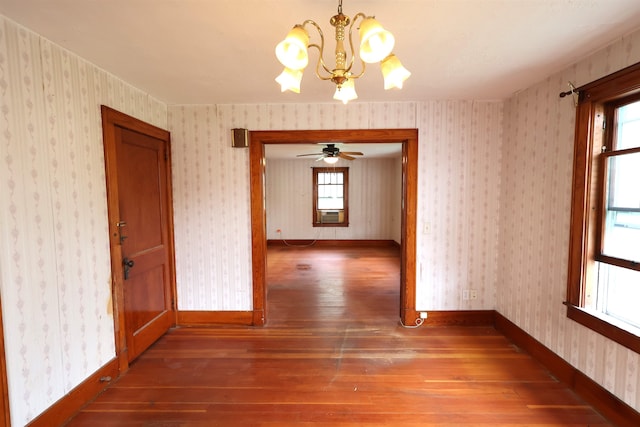 interior space featuring a wealth of natural light, a chandelier, and wood-type flooring