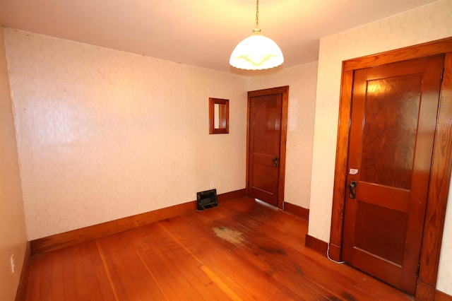 unfurnished room featuring dark hardwood / wood-style flooring