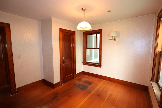 spare room featuring dark hardwood / wood-style floors