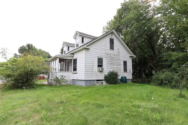 view of home's exterior featuring a yard