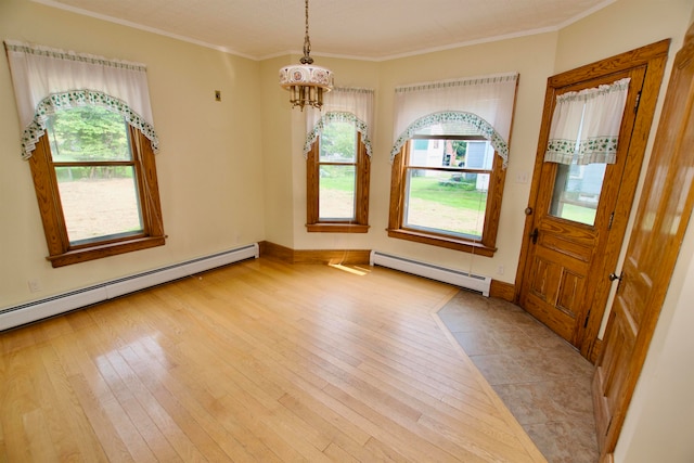 foyer with a baseboard radiator, a chandelier, and light wood-type flooring