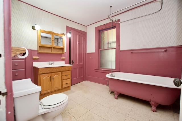 bathroom with tile patterned flooring, toilet, and vanity