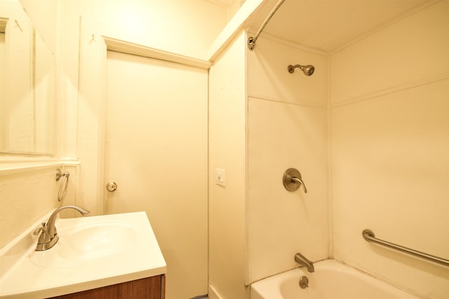 bathroom featuring washtub / shower combination and vanity