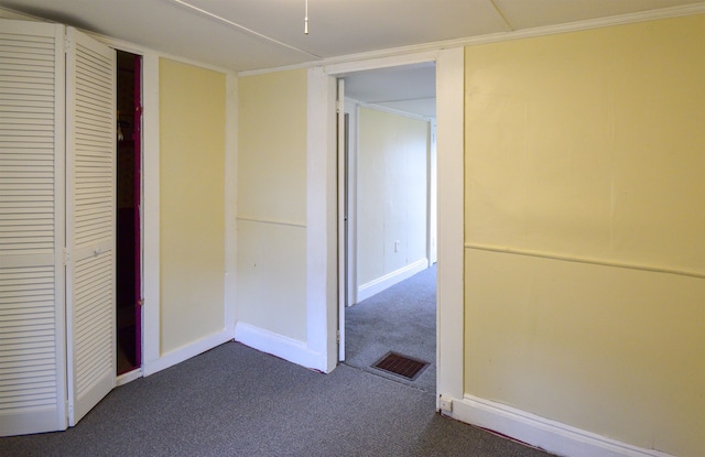 unfurnished bedroom featuring a closet and carpet