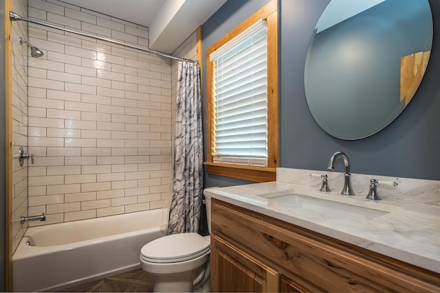 full bathroom with vanity, shower / tub combo with curtain, toilet, and a wealth of natural light