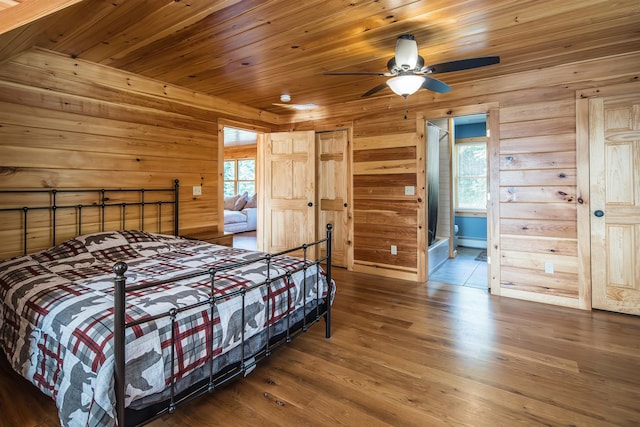 bedroom featuring wooden ceiling, connected bathroom, hardwood / wood-style flooring, and ceiling fan