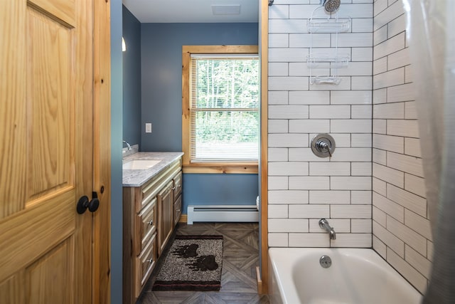 bathroom with parquet flooring, tiled shower / bath, vanity, and a baseboard radiator