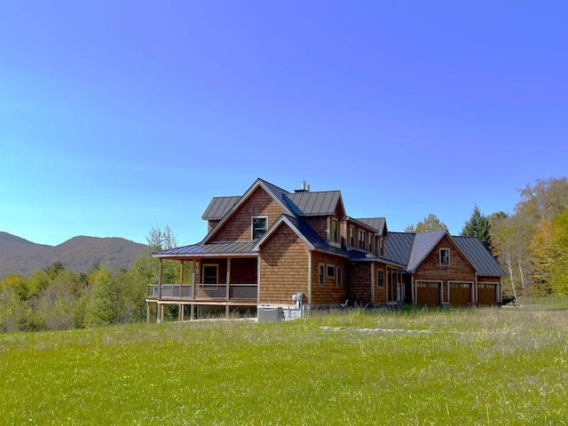 rear view of property with a mountain view