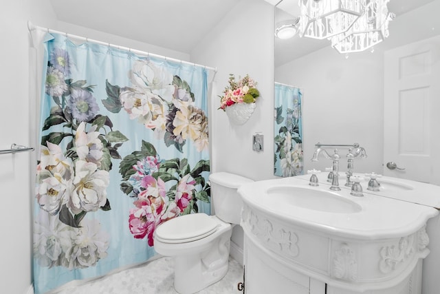 full bathroom with toilet, a notable chandelier, vaulted ceiling, and vanity