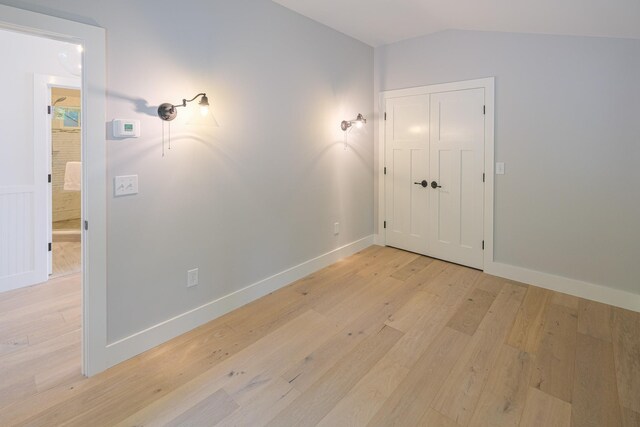 bathroom featuring hardwood / wood-style floors, vanity, and a shower with shower door