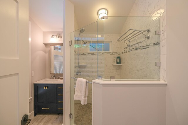 interior space featuring baseboard heating, a water view, lofted ceiling with beams, and light wood-type flooring