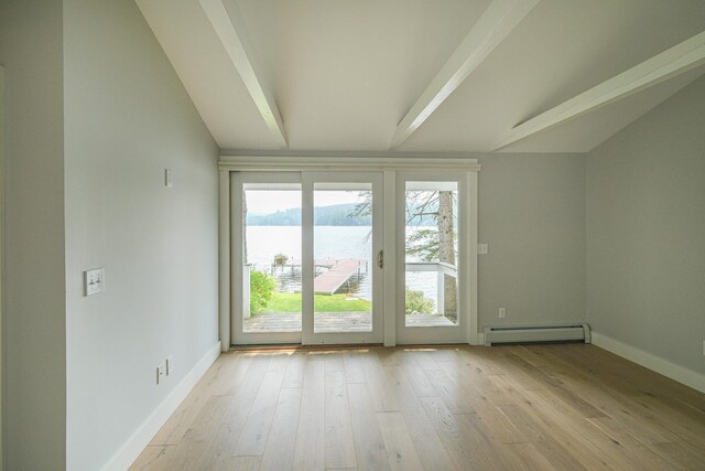 hall featuring dark hardwood / wood-style flooring and vaulted ceiling