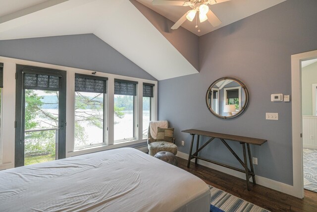 back of property featuring a sunroom, a yard, and a water view