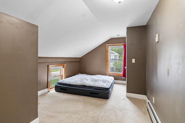 14 School St, Highgate, VT 05459 - carpeted bedroom with baseboards, vaulted ceiling, and a baseboard radiator