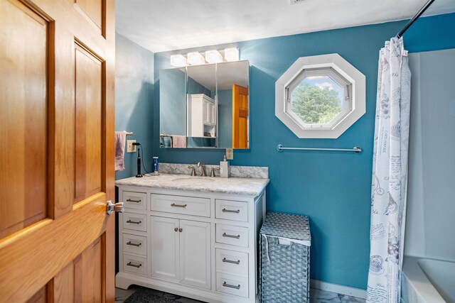 14 School St, Highgate, VT 05459 - bathroom with baseboards, shower / tub combo, and vanity
