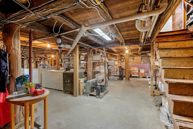 unfinished below grade area with stairway and washer and dryer