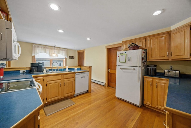 kitchen with white appliances, a baseboard radiator, light wood-type flooring, a sink, and recessed lighting