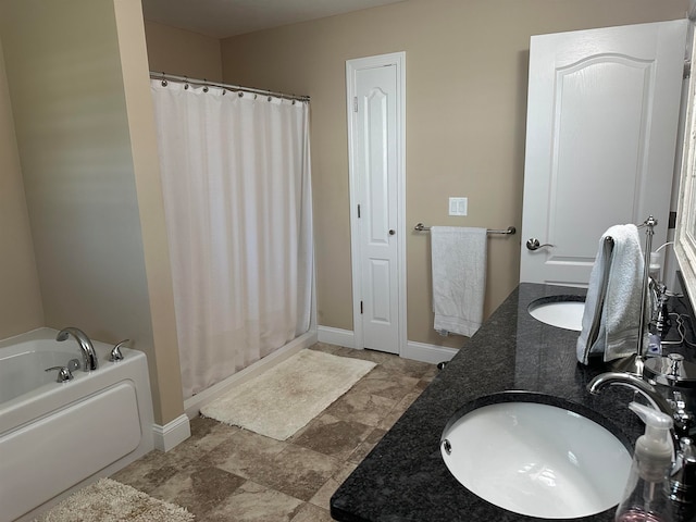 bathroom with vanity and a bathtub