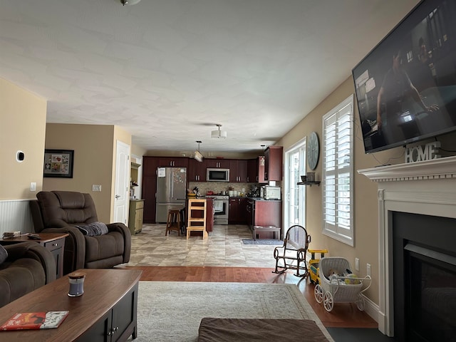 living room with light hardwood / wood-style flooring