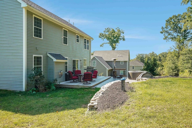 rear view of house featuring a yard and a deck