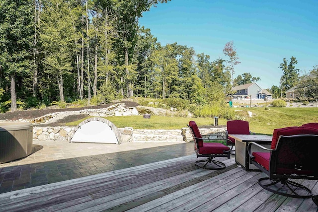 wooden terrace with a yard and a patio