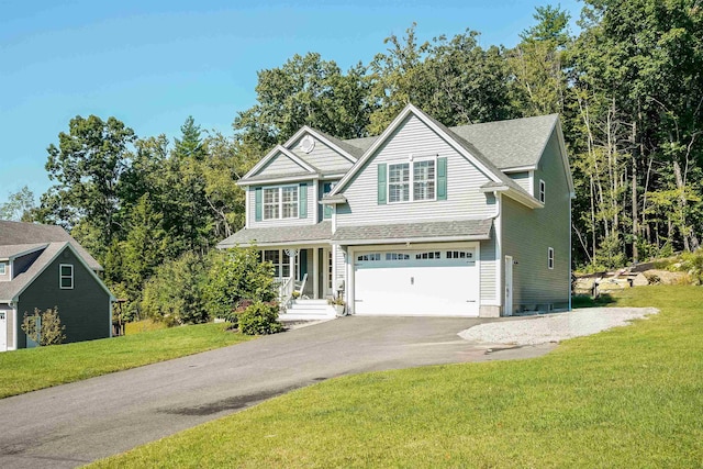 view of front facade with a garage and a front lawn