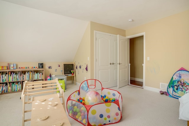 game room with lofted ceiling and carpet