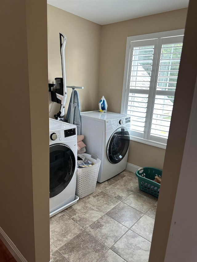 laundry room featuring washer and clothes dryer