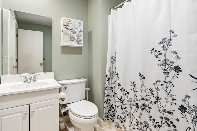 bathroom with tile patterned floors, toilet, vanity, and a shower with curtain