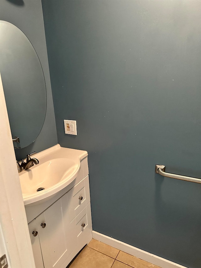 bathroom with tile patterned flooring and vanity