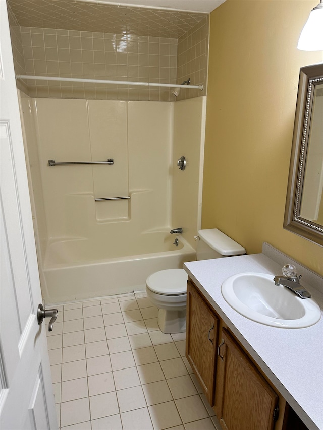 full bathroom with tile patterned flooring, bathtub / shower combination, vanity, and toilet