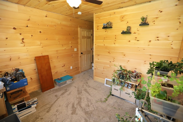 misc room with ceiling fan, wooden ceiling, and light colored carpet