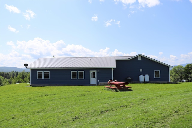 back of house with a yard