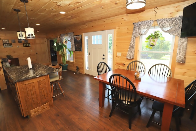 dining area featuring wood walls, dark wood-type flooring, and wood ceiling