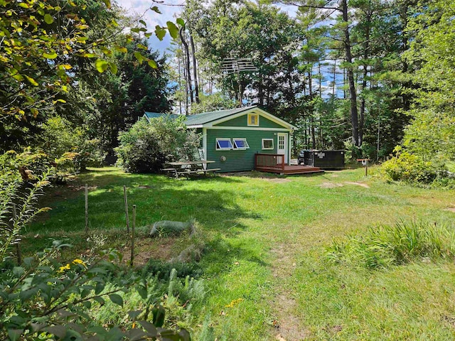 view of yard featuring a wooden deck