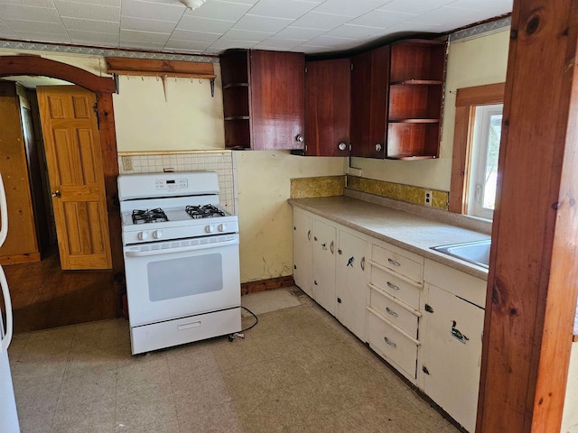 kitchen with white range with gas cooktop