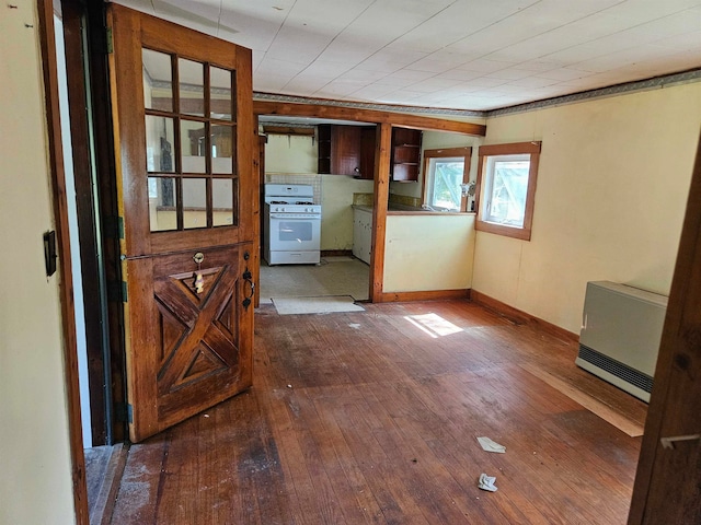 interior space featuring hardwood / wood-style flooring and heating unit