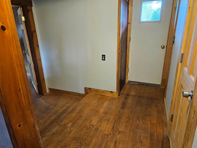 corridor featuring dark hardwood / wood-style floors