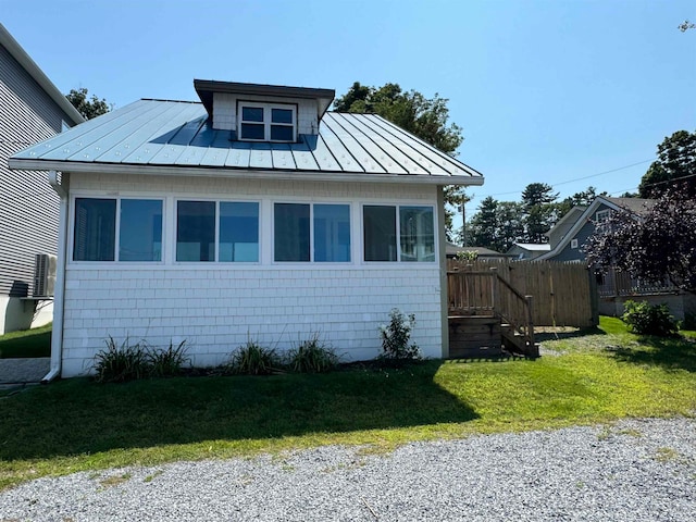 view of property exterior featuring a yard