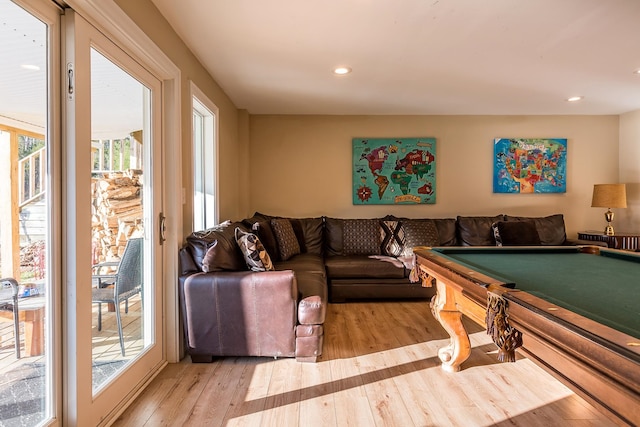 rec room featuring light hardwood / wood-style floors, pool table, and a healthy amount of sunlight