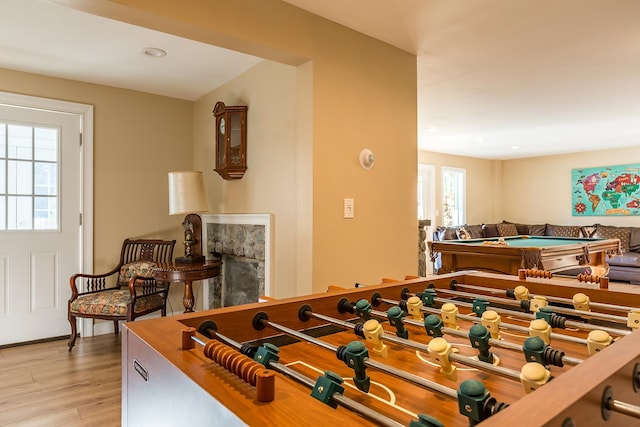 recreation room featuring billiards and light hardwood / wood-style floors