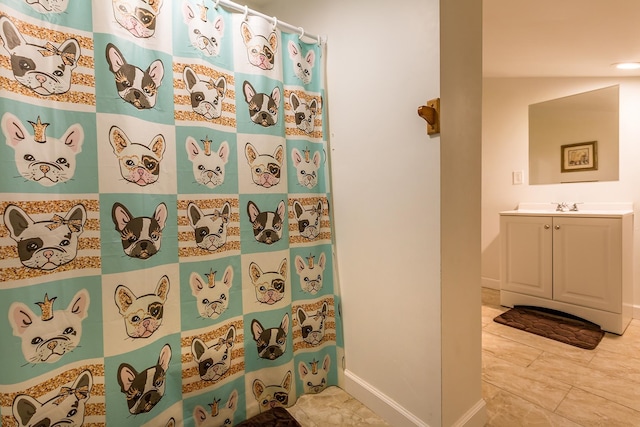 bathroom featuring tile patterned floors, vanity, and a shower with shower curtain