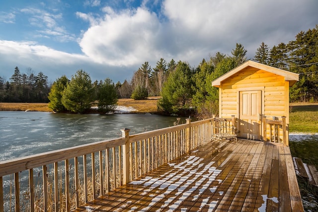 wooden terrace featuring a water view