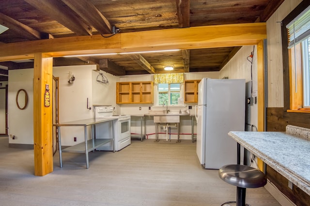 kitchen with white appliances, light countertops, wood ceiling, light wood-style floors, and beamed ceiling