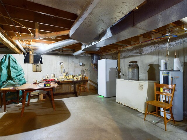 basement with gas water heater and a workshop area