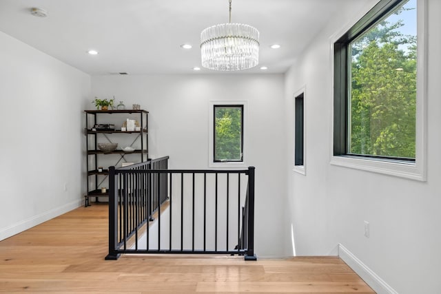 interior space featuring a chandelier and hardwood / wood-style floors